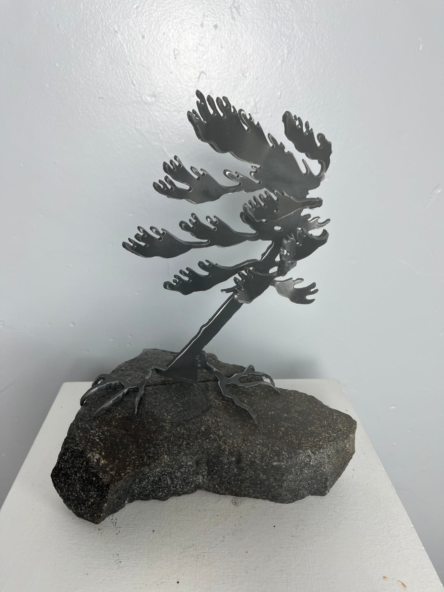 Cathy mark windswept metal tree on stone