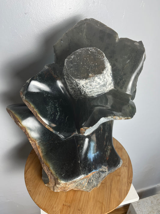 Stone flower sculpture by artist Dawson Chivazhe