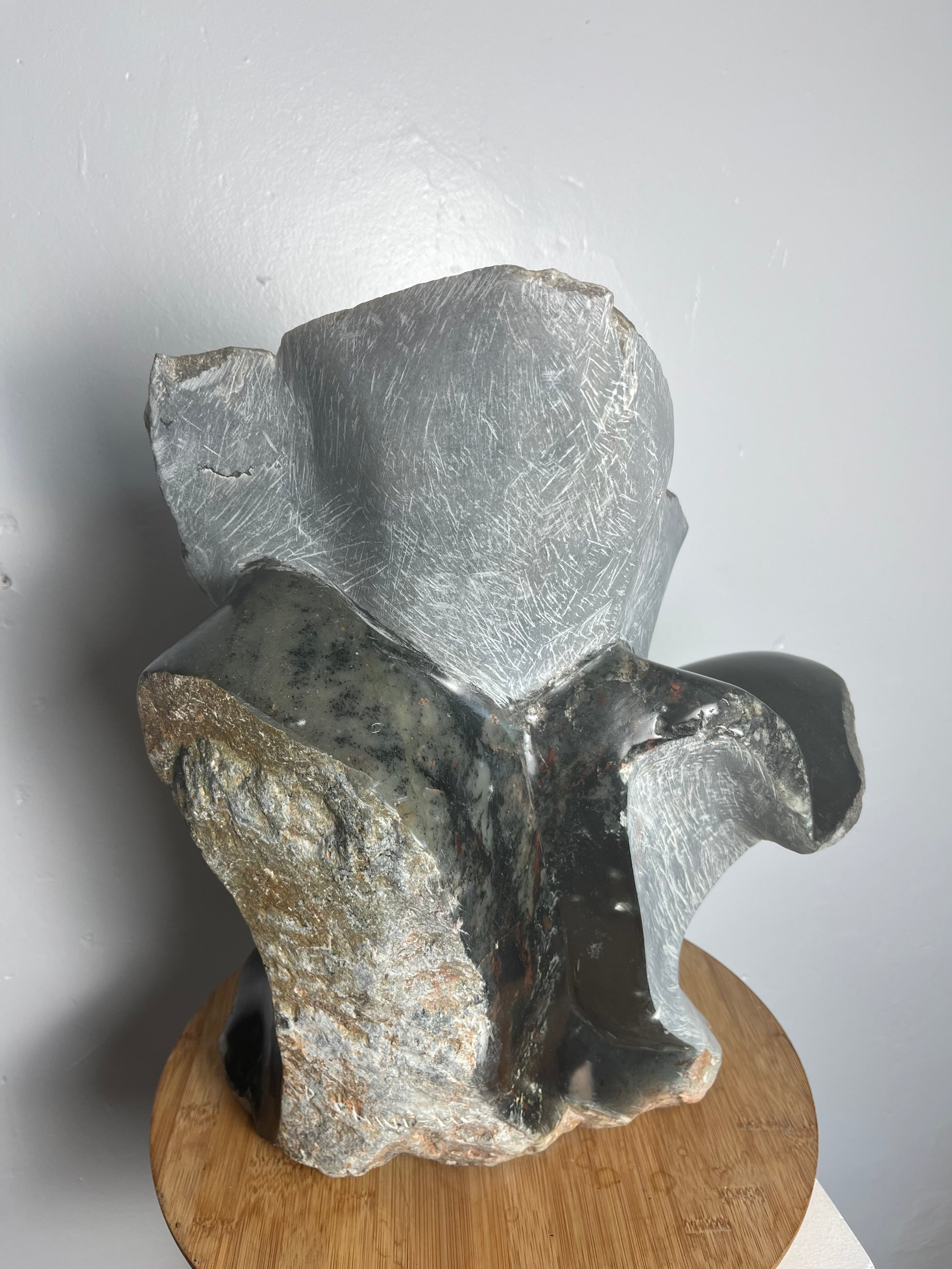 Stone flower sculpture by artist Dawson Chivazhe