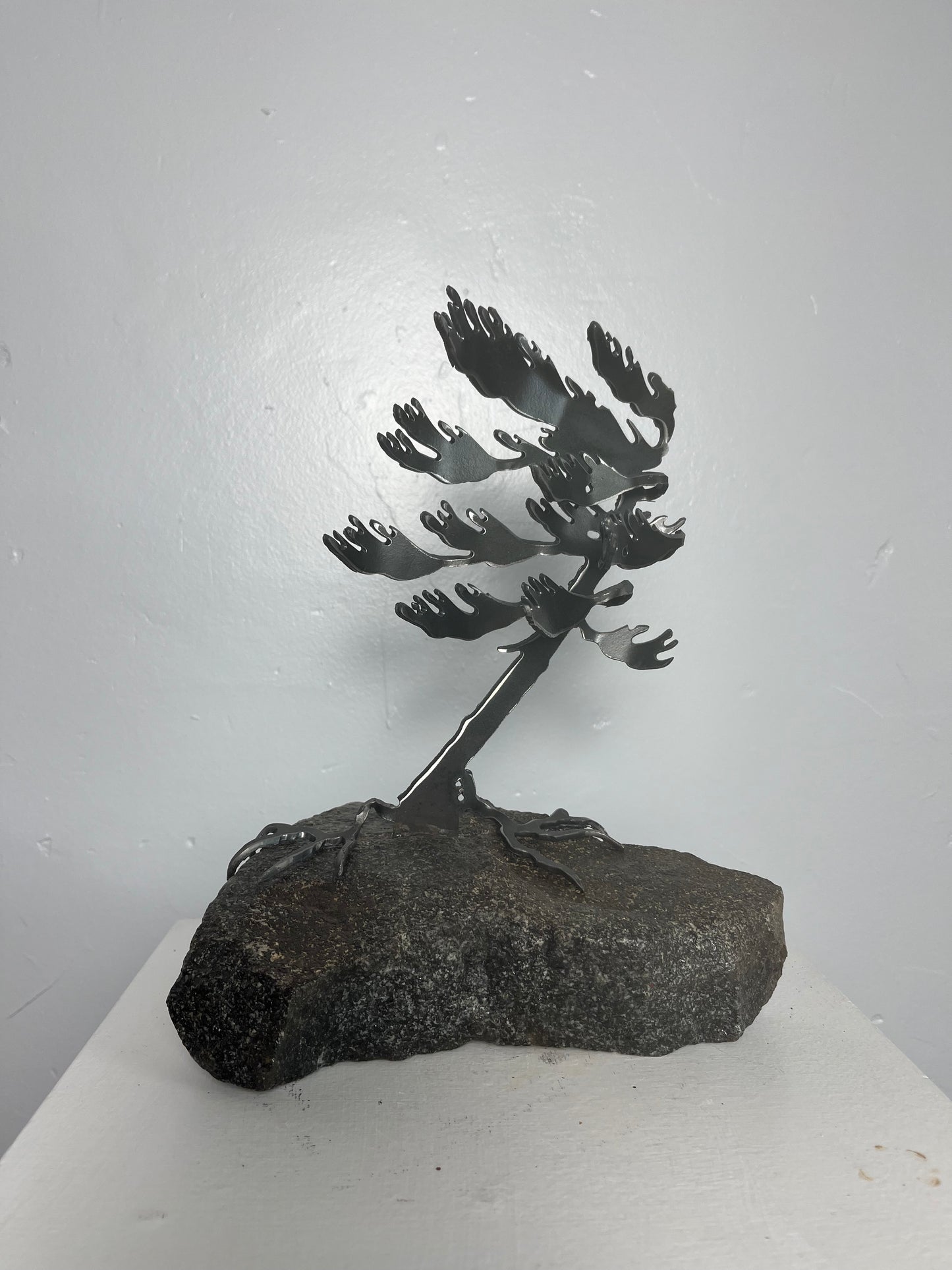 Cathy mark windswept metal tree on stone