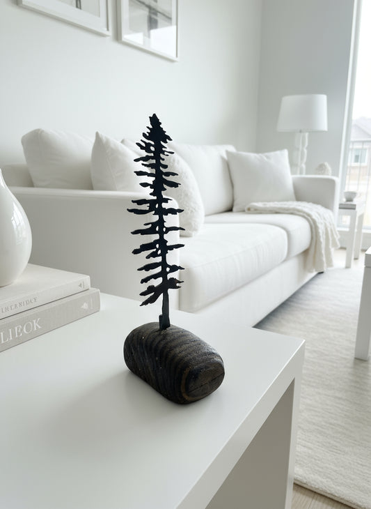 metal tree on driftwood