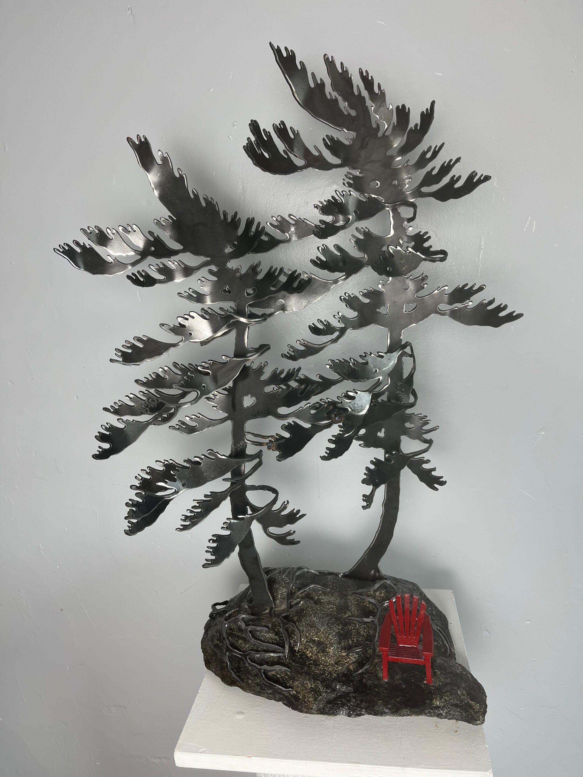 Cathy mark windswept metal tree on stone