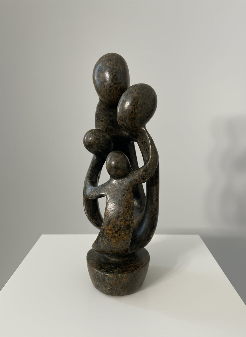 Stone sculpture carved in Zimbabwe family of 4 side view