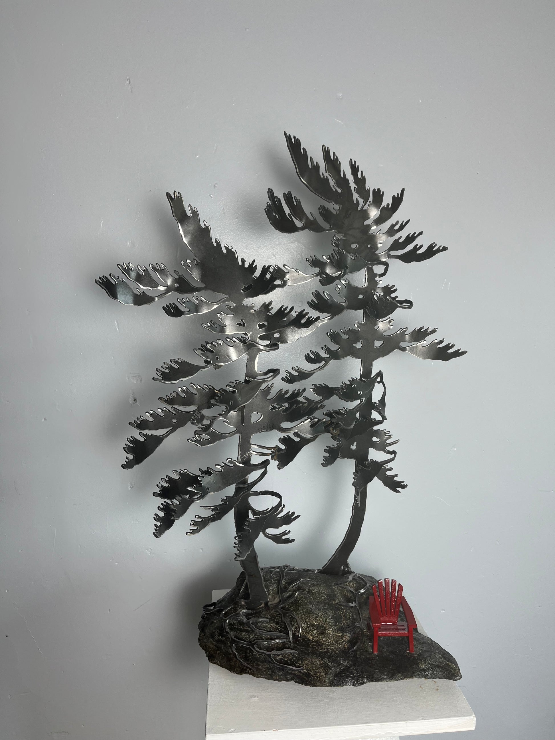 Cathy mark windswept metal tree on stone