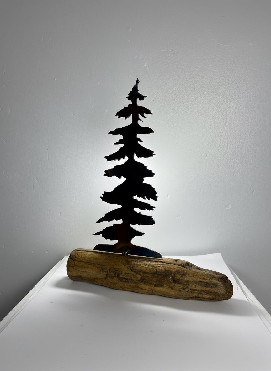 Metal trees on driftwood