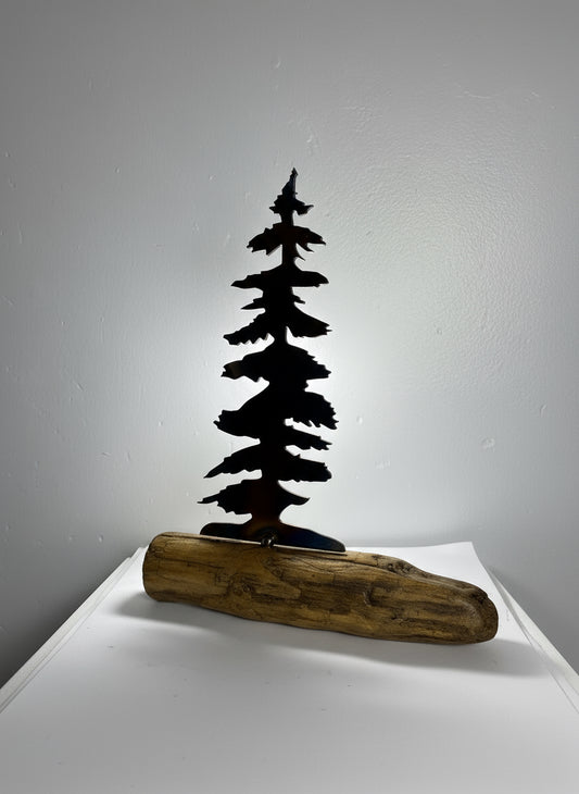 Metal trees on driftwood