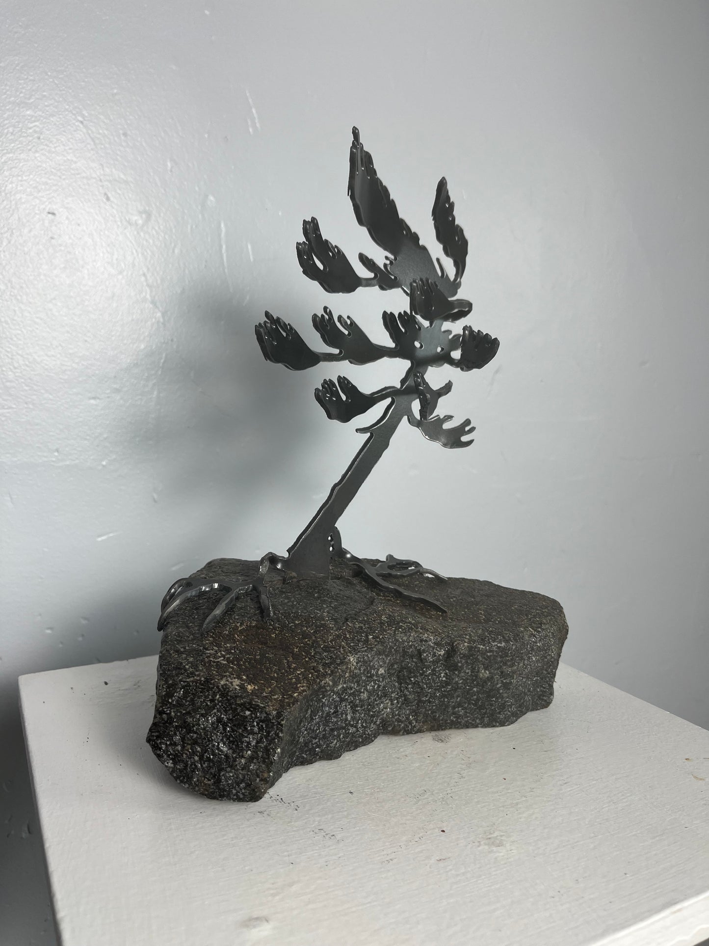 Cathy mark windswept metal tree on stone