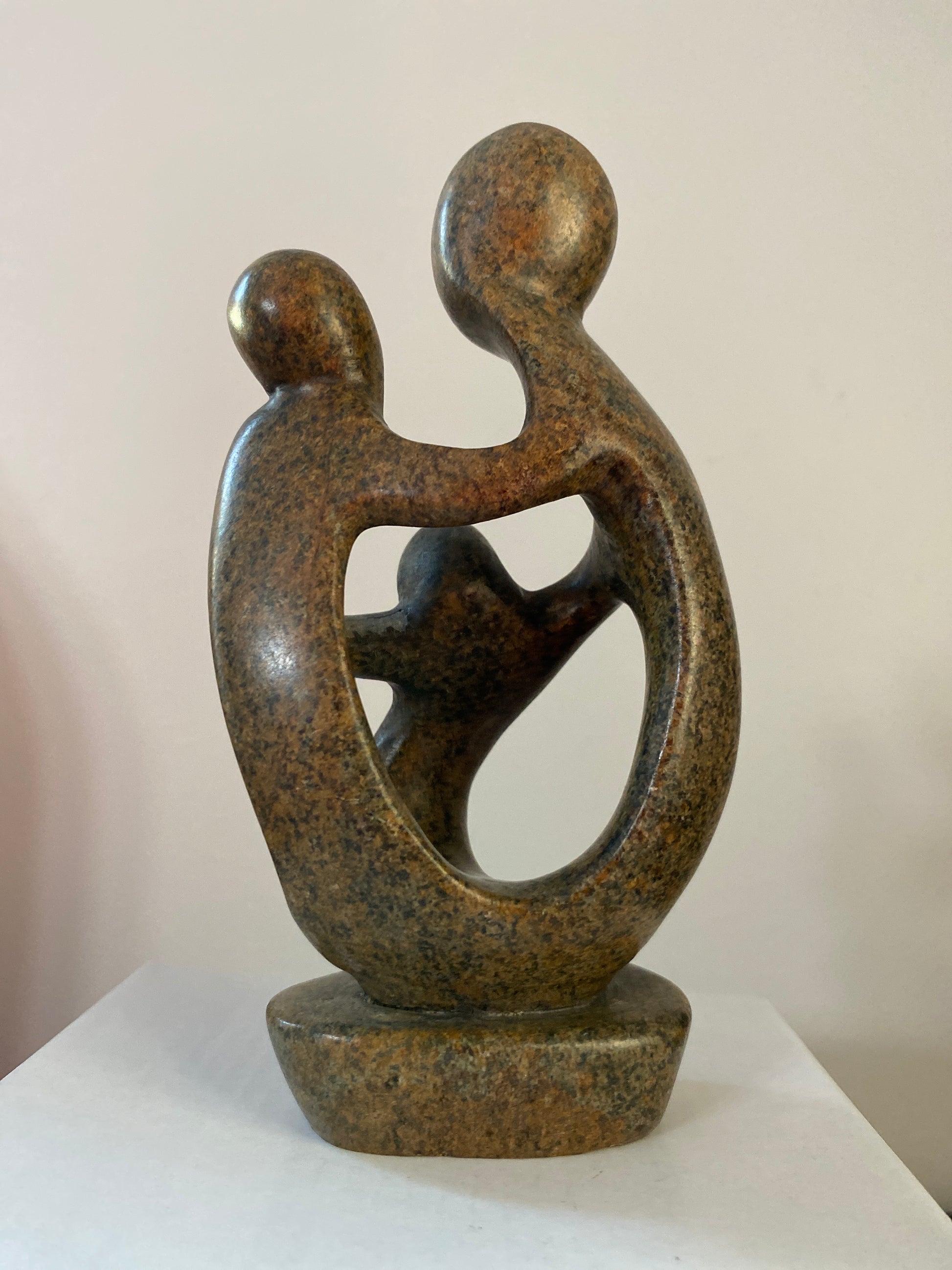 Back of Stone Sculpture family of 3