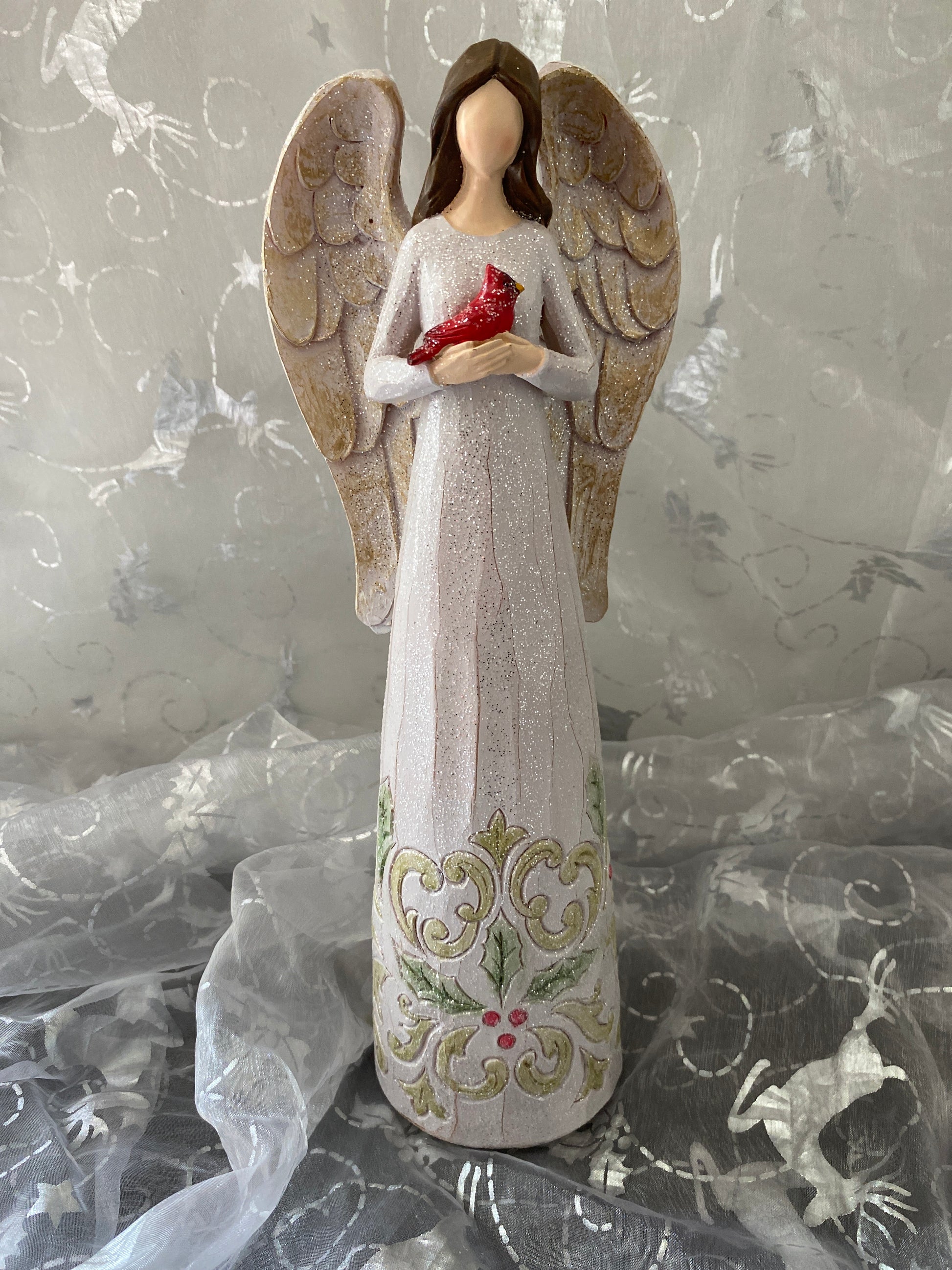 Angel Holding a Cardinal Sparkles