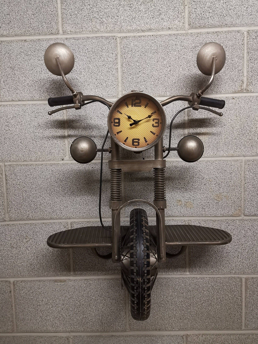 Motorcycle-shaped wall clock on a tiled wall