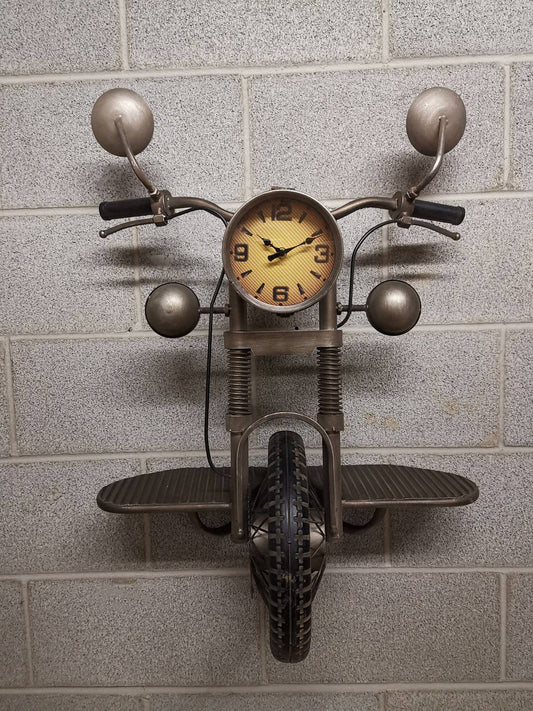 Motorcycle-shaped wall clock on a tiled wall
