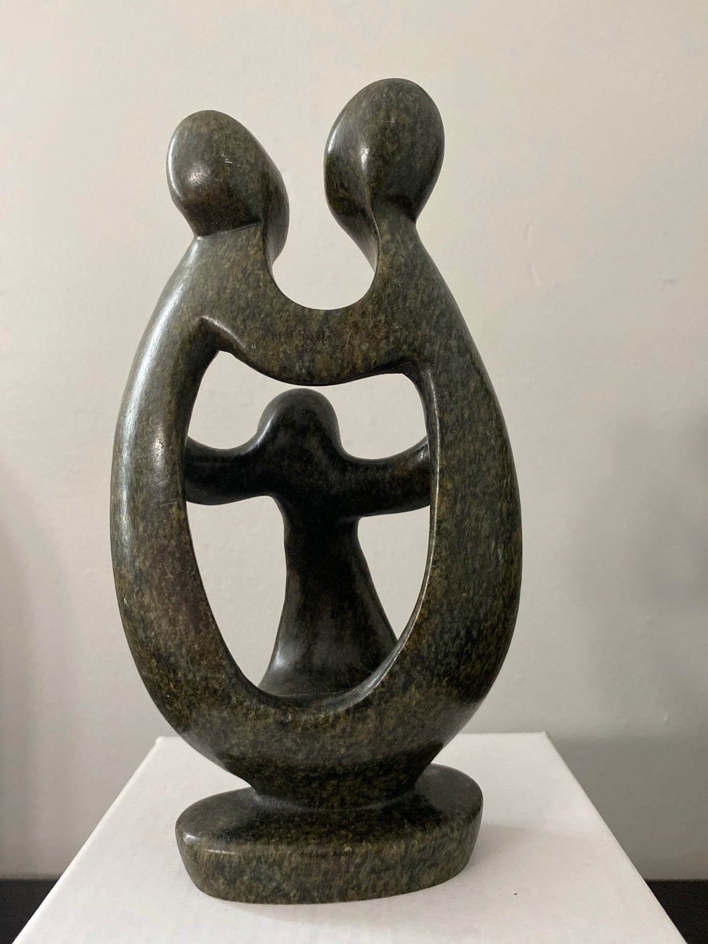 Back view of  shona sculpture family of 3