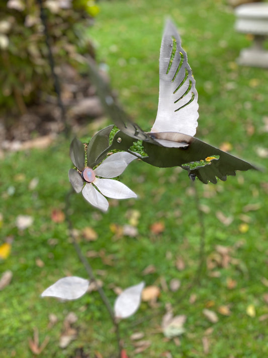Metal hummingbird and flower garden stake