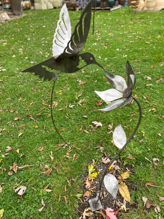 Metal hummingbird and flower garden stake