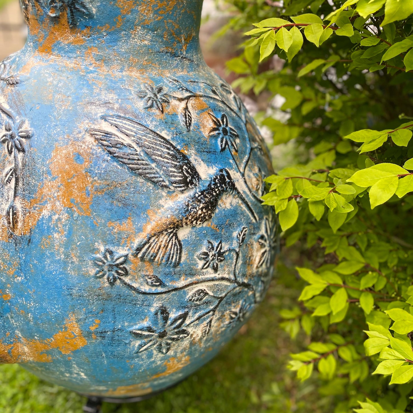 Chiminea made in Mexico with hummingbirds side view