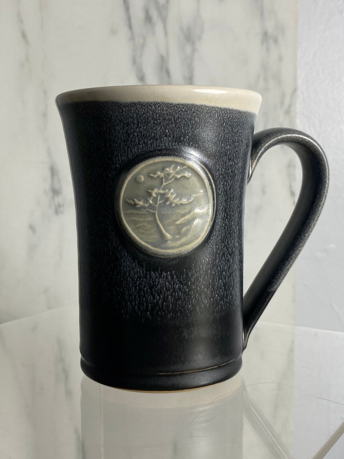 Handmade pottery medallion mug