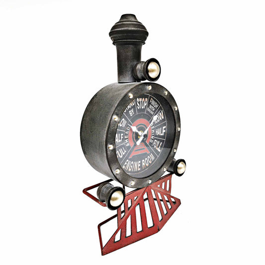 Decorative clock designed like a vintage engine gauge on a white background
