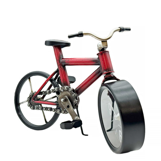 Red bicycle with a large black wheel on a white background