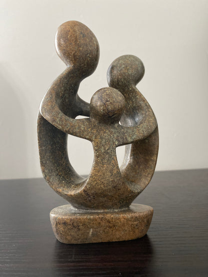 Stone Sculpture of a family of 3