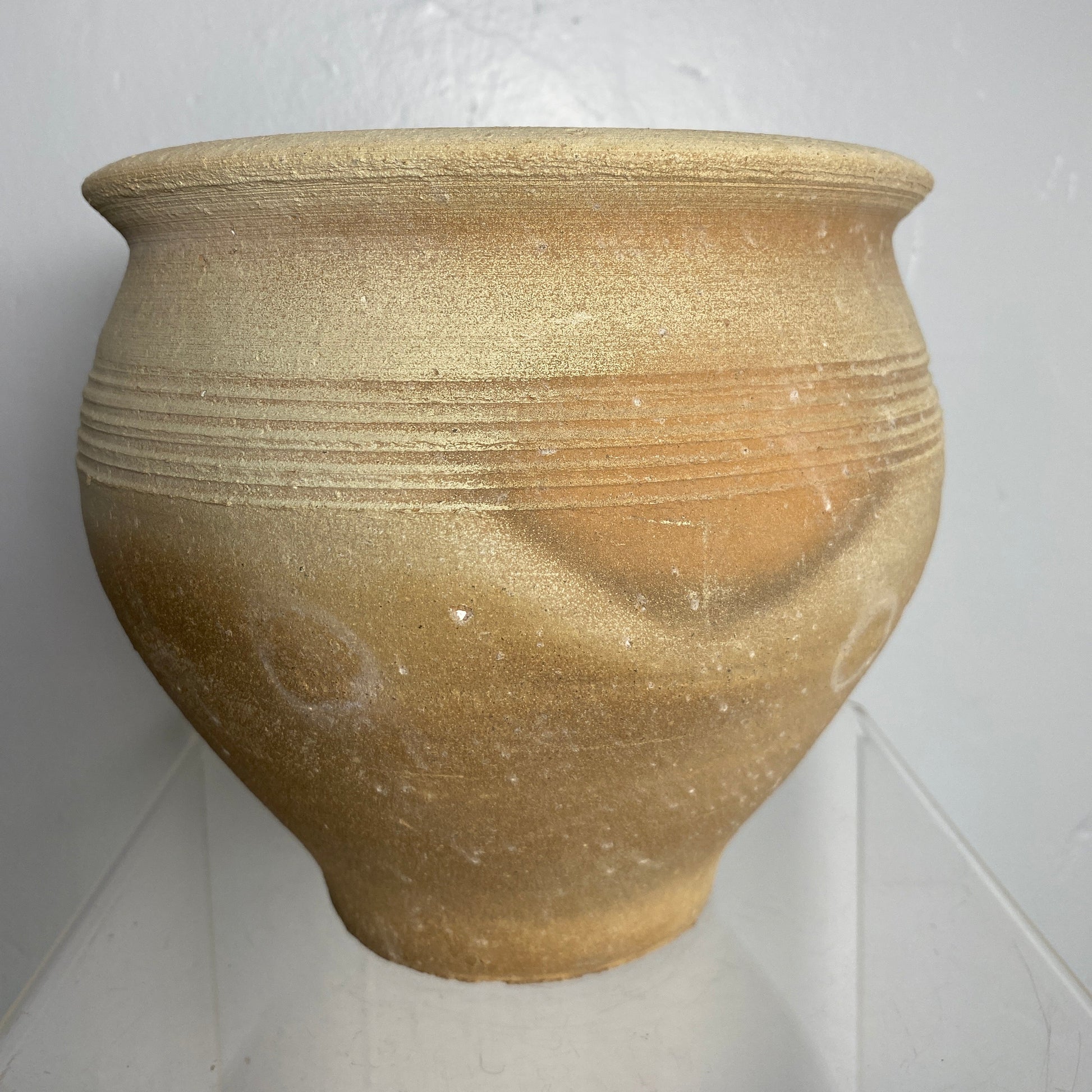 Teracotta vase with ribbed texture