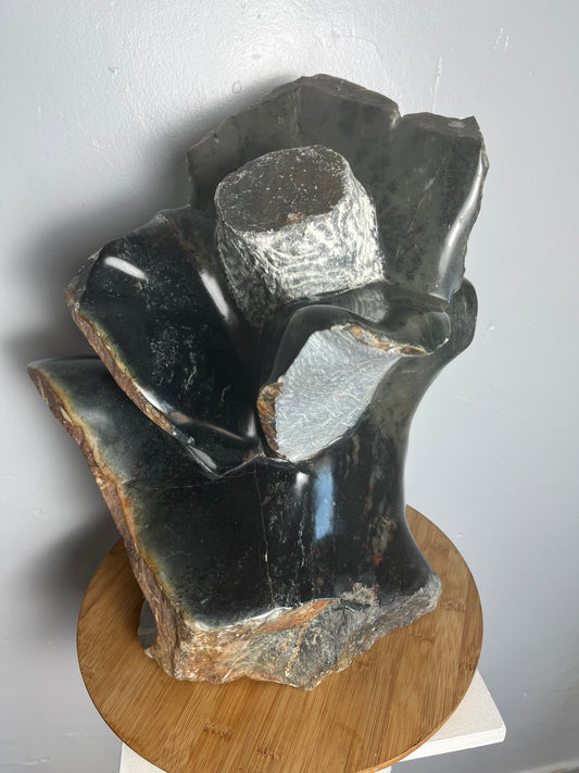 Stone flower sculpture by artist Dawson Chivazhe