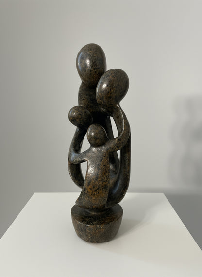 Stone sculpture carved in Zimbabwe family of 4 side view