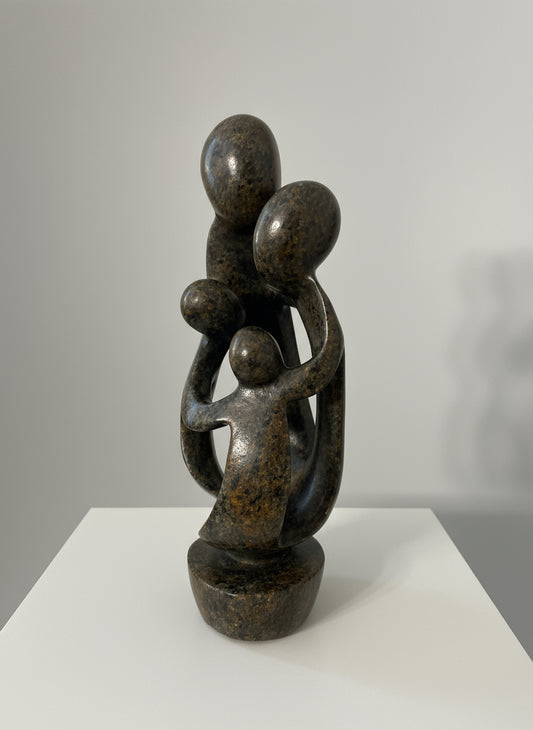 Stone sculpture carved in Zimbabwe family of 4 side view