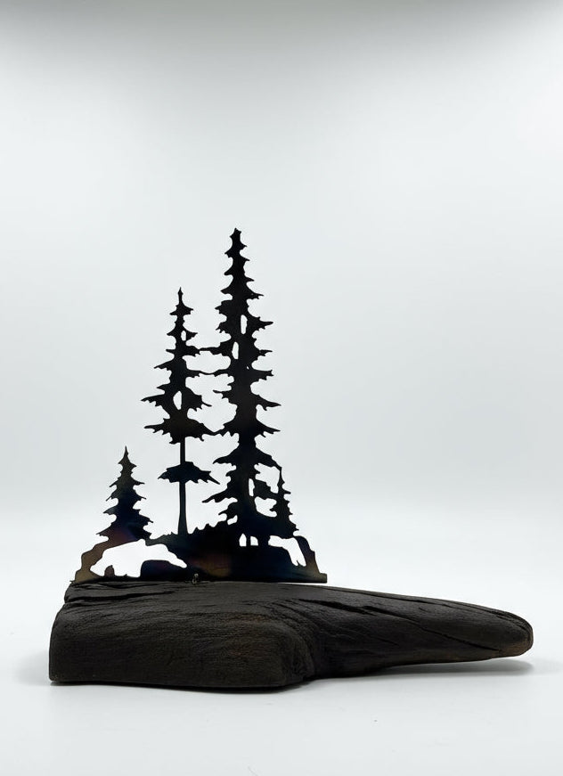 Metal trees on Canadian drift wood