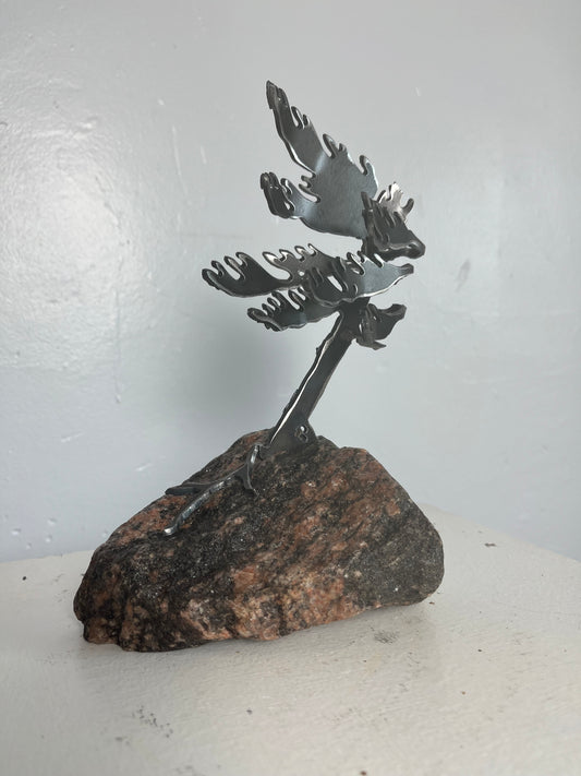 Cathy mark windswept metal pine tree on stone
