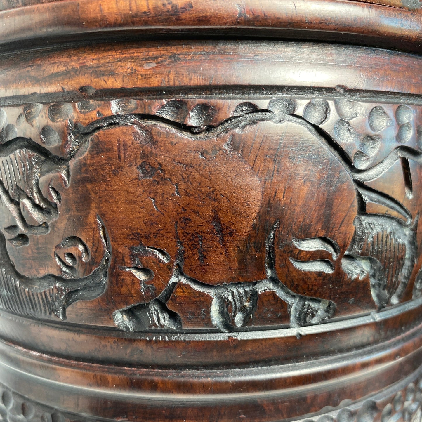 Rhino carving in wood jar