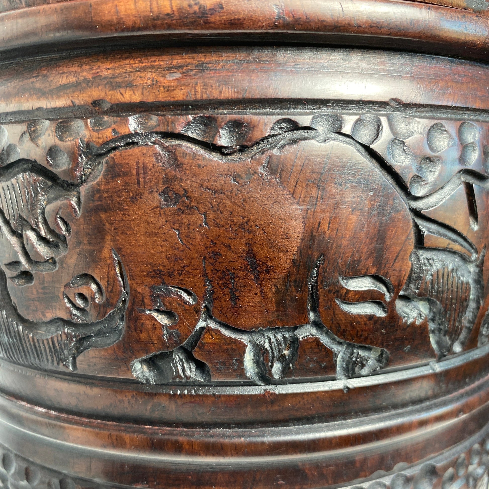 Rhino carving in wood jar