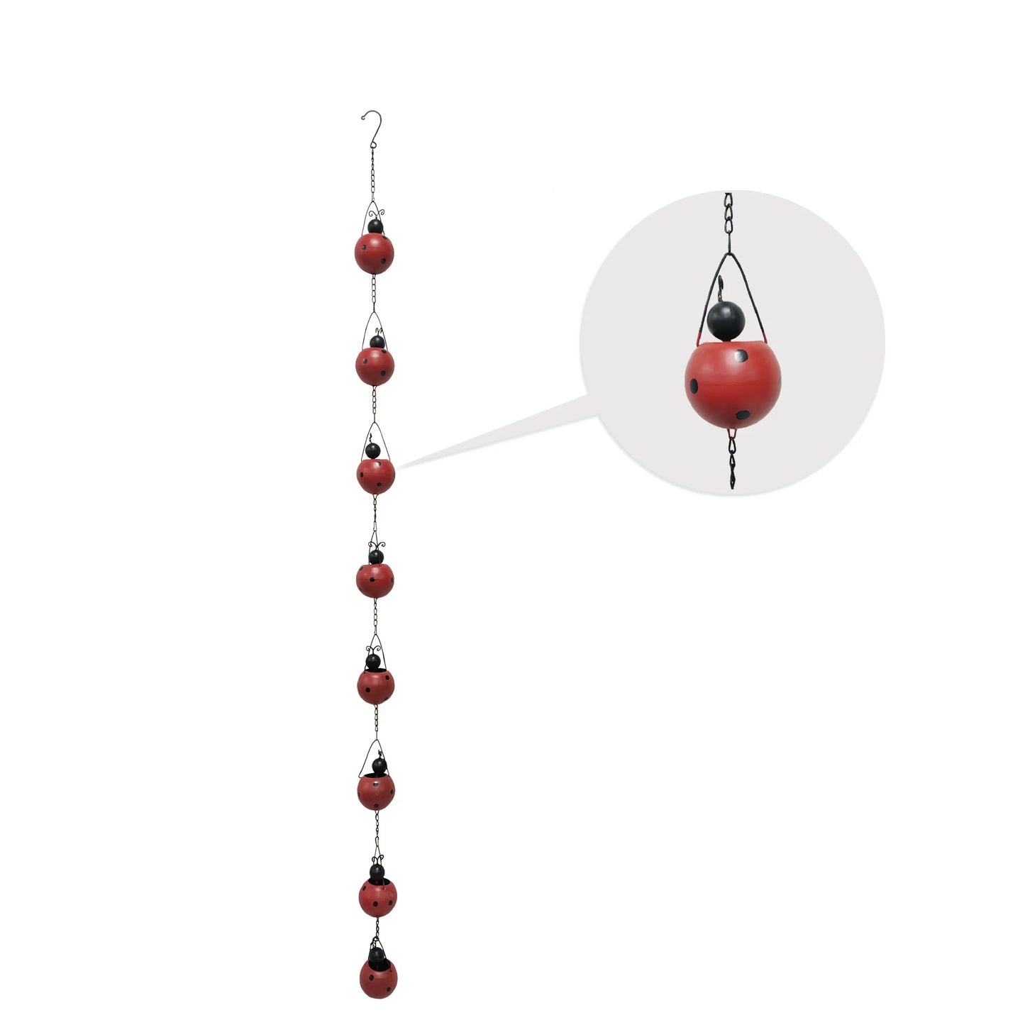 Ladybug Rain Chain hanging from an eaves trough