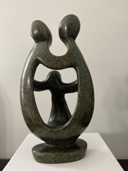 Back view of  shona sculpture family of 3