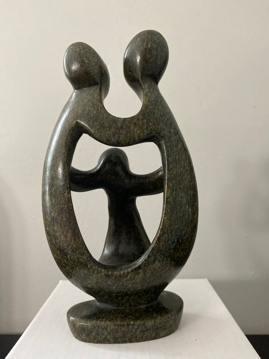 Back view of  shona sculpture family of 3