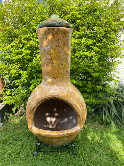 Decorative outdoor chiminea with a lid 