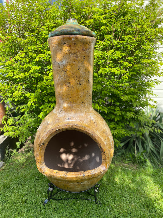 Decorative outdoor chiminea with a lid 