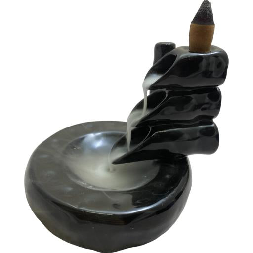 Black spiral incense burner with a cone on a white background