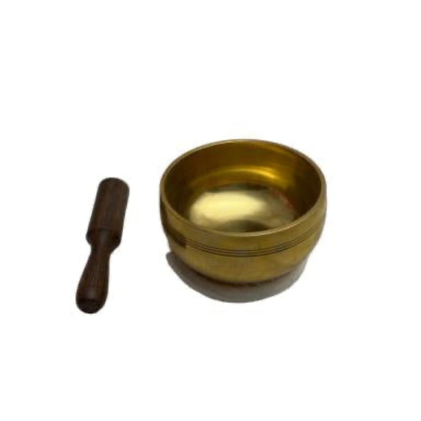 Brass singing bowl with wooden striker on a white background