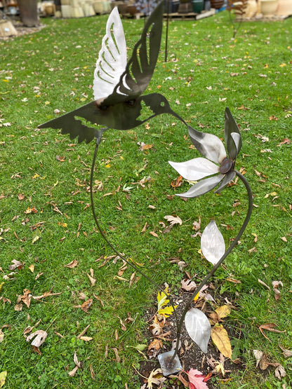 Metal hummingbird and flower garden stake