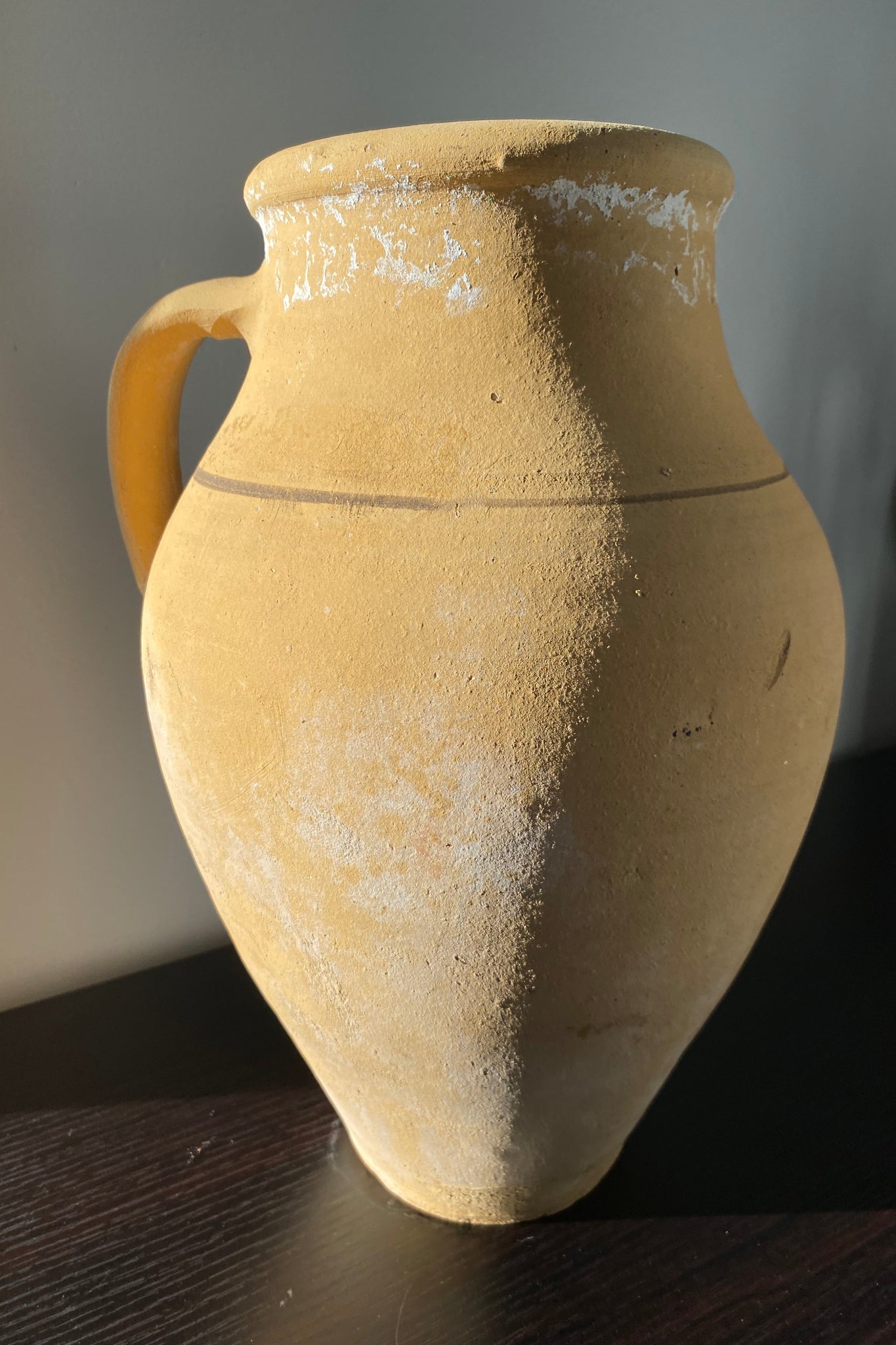 Ancient ceramic jar with a handle 