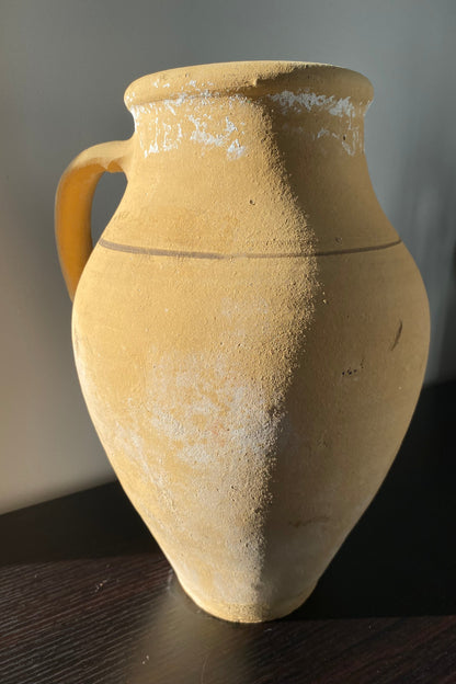 Ancient ceramic jar with a handle 