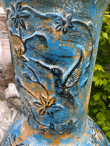 Chiminea made in Mexico with hummingbirds side view