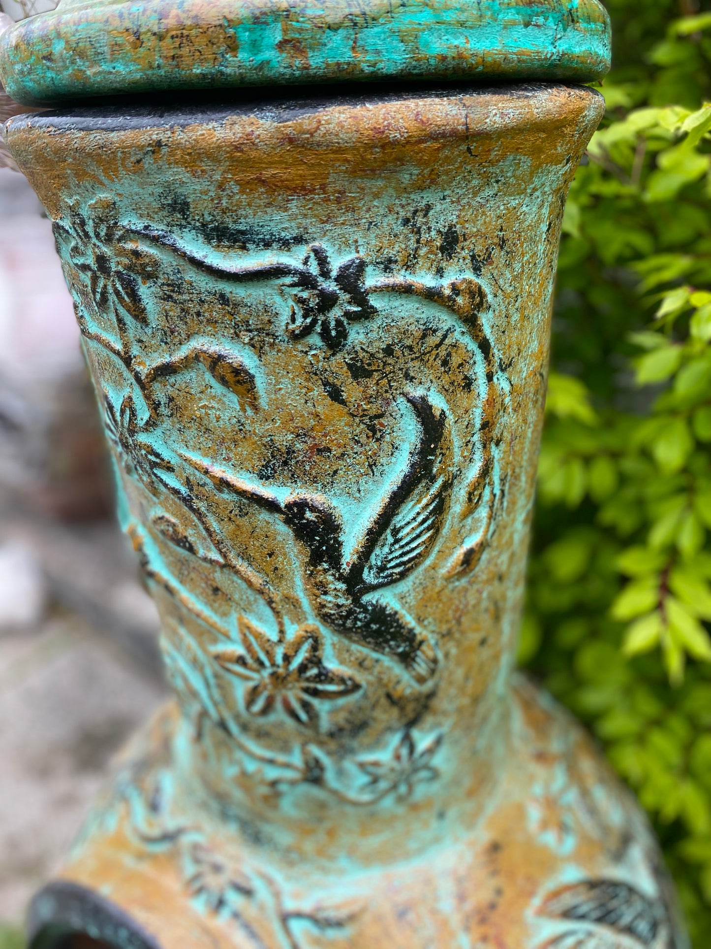 Chiminea made in Mexico with hummingbirds side view