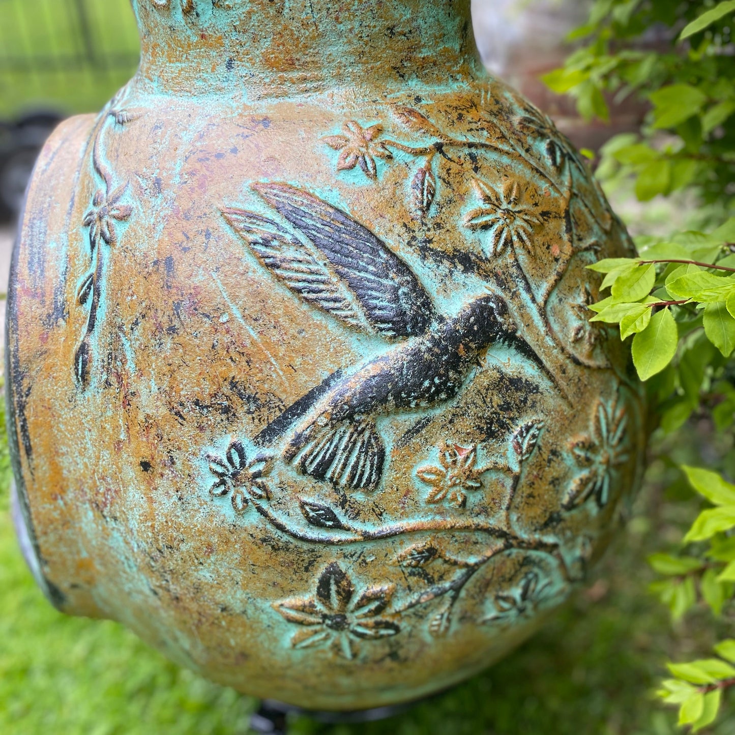 Chiminea made in Mexico with hummingbirds side view