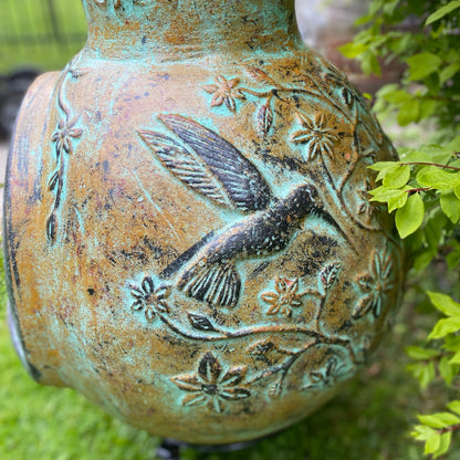 Chiminea made in Mexico with hummingbirds side view