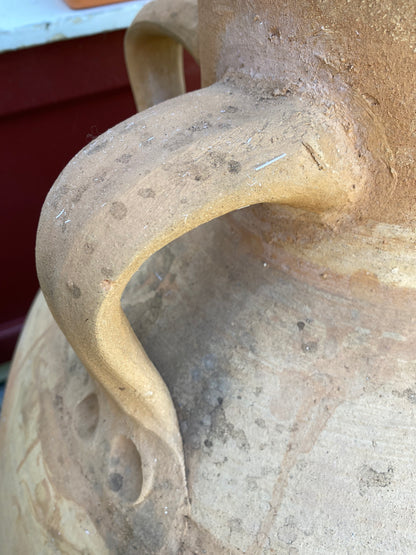 Close-up of handles of decorative pot
