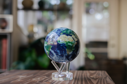MOVA Globe Earth with Clouds 4.5 inch solar-powered rotating globe on display
