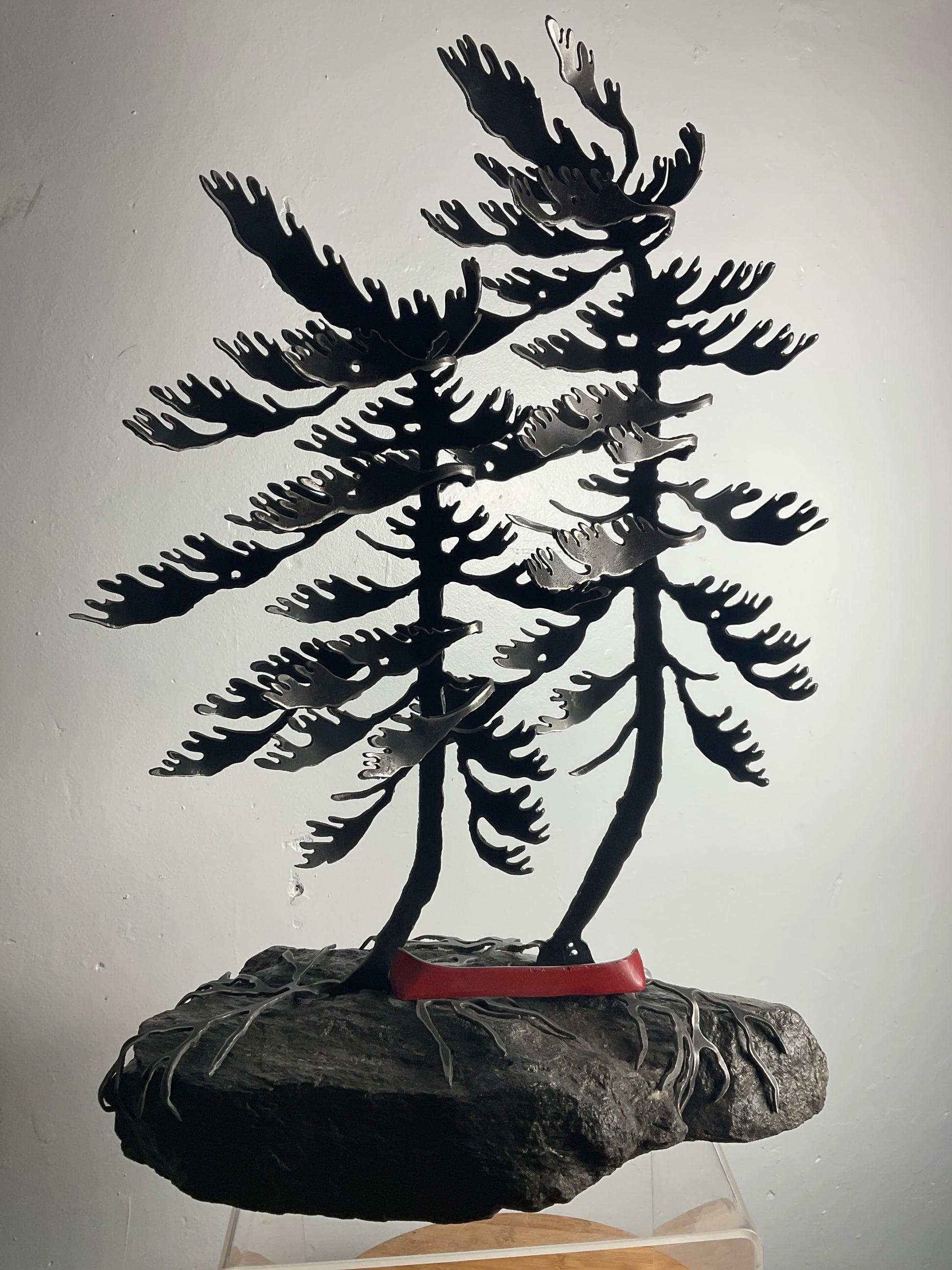 Cathy Mark windswept pine with red canoe on granite