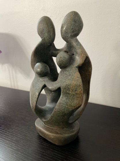 Stone sculpture of a family of 4 - Ukama - 4K