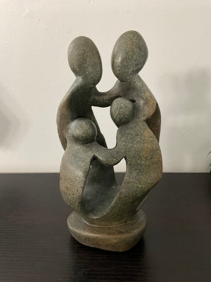 Stone sculpture of a family of 4 - Ukama - 4K